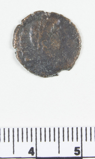 Hearst Museum object 3 of 8 titled Coin: æ 4, accession number 8-7336, described as Coin, AES Follis 4.         1.21 grams. 15mm. Obverse: Constantius II Reverse: Standard between 2 soldiers