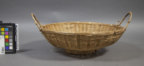 Hearst Museum object titled Basket, accession number 9-12870, described as Basket; round basin-shaped basket with 2 carrying handles and ring base; diameter not including handles 35 cm. Bamboo in wicker weave