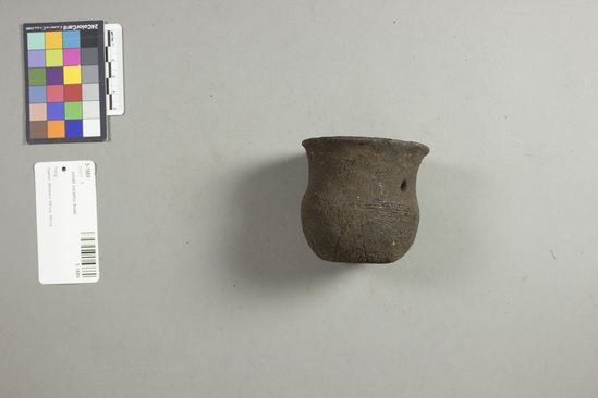 Hearst Museum object 1 of 2 titled Bowl, accession number 5-1889, described as Small black clay pot with outer inoised design(mve); 2¾" (6.97 cm) rim dia, 2 ½" (6.35cm) h