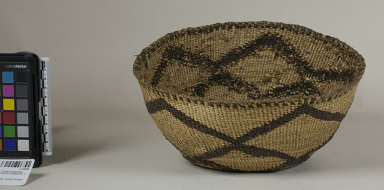 Hearst Museum object 2 of 2 titled Food basket, accession number 1-14236, described as Food basket; twined. Warp is twisted Tule (Schoenoplectus acutus), weft is also twisted Tule. White pattern is Reed (Phragmites vulgaris). Brown color is mud-dyed Tule. Lattice design in black.