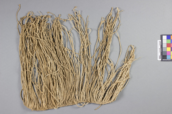 Hearst Museum object titled Bundle of twine, accession number 5-9889, described as Headband; string; twisted strands hung from sinew cord; several copper rings on end; approx. l. 25 cm.