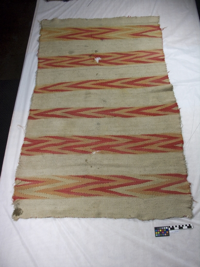 Hearst Museum object titled Blanket, accession number 2-15898, described as White ground with cross bands of zigzagged red, yellow, orange.  Wool in tapestry weave.