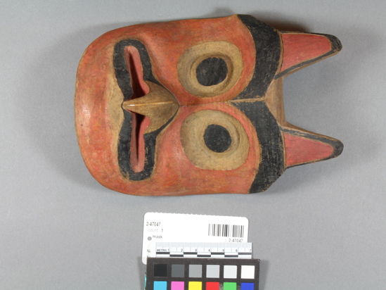 Hearst Museum object 2 of 2 titled Mask, accession number 2-47047, described as Representing hawk. Curved beak touching face, no eye holes. Red and black pigment.