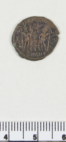 Hearst Museum object titled Coin: æ 4, accession number 8-8710, described as Coin, AES Follis 4. 1.21 grams. 16 mm. Obverse: Constantius II right, diademed CONSTANTINVS AVG Reverse: Standard between 2 soldiers, Gloria Exercitvs Mint Data: Constantius II