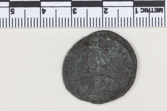 Hearst Museum object 5 of 8 titled Coin: billon antoninianus, accession number 8-4068, described as Coin; Billon; Antoninianus; Roman. 5.40 grams, 26 mm. Aurelian, 270-275 AD. Rome, Italy. Obverse: IMP C AVRELIANVS, Bust r. radiate. Reverse: ORIENS AVG, Sol l., between two captives, in exergue T M