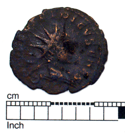 Hearst Museum object titled Coin: æ antoninianus, accession number 8-6215, described as Coin: Antoninianus; Æ (AR?); Tetricus II - 2.20 grms. Obverse: C PIV ESV TETRICVS CAES - Bust facing right radiate, draped. Reverse: [SPE]S AVGG - Spes walking facing left holding flower and lifting skirt.