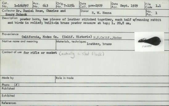 Documentation associated with Hearst Museum object titled Powder horn, accession number 1-164897, described as Powder horn, made of two pieces of leather stitched together, each half with running rabbit and birds in relief; built-in brass powder measure at top.
