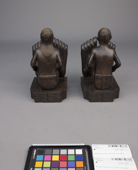 Hearst Museum object 5 of 8 titled Wood figurine, accession number 10-3141a,b, described as Bookends, wooden, male and female figures, 27 centimeters by 10 centimeters