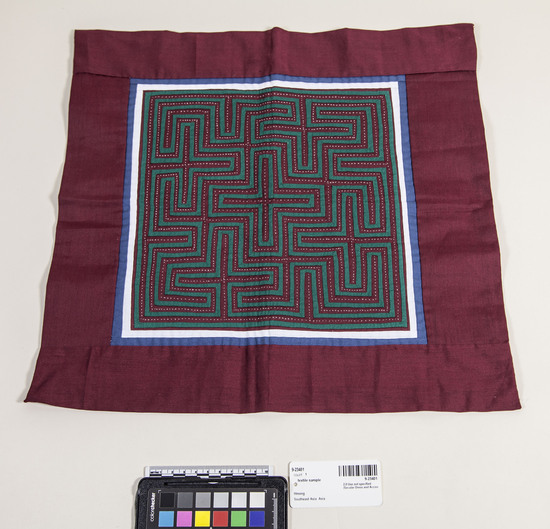 Hearst Museum object titled Textile sample, accession number 9-23401, described as Dark red background with green, white and blue geometric appliqué.