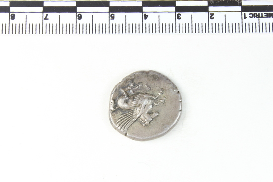 Hearst Museum object 2 of 10 titled Coin: ar stater, accession number 8-5484, described as Coin; AR; Stater; Greek. 8.4312 grams, 23 mm. 400-338 BC. Corinth, Greece. Obverse: Pegasus with pointed wings flying l.; below, Ϙ. Reverse: Head of Pallas l. helmeted; in field, ΔΙ; to right, Artemis (Latin: Diana) running l., holding long torch with both hands. Remarks: "condition, excellent.