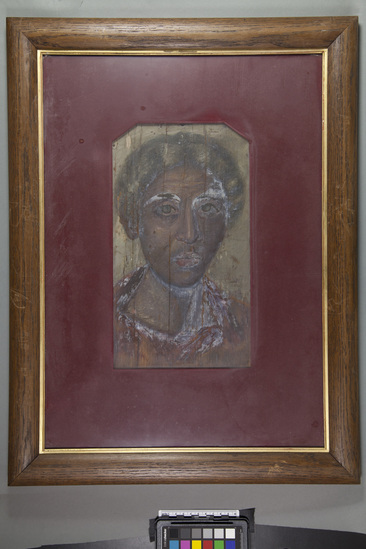 Hearst Museum object titled Mummy portrait (reproduction), accession number 5-374, described as Copy of Greek mummy portrait from the Fayum Egypt Original painted in the 3rd century Originals discovered by Flinders Petrie are in National Gallery London. Painted in wax colors applied with brush to cestrum. Copies by Eleanor Harrison Supplee