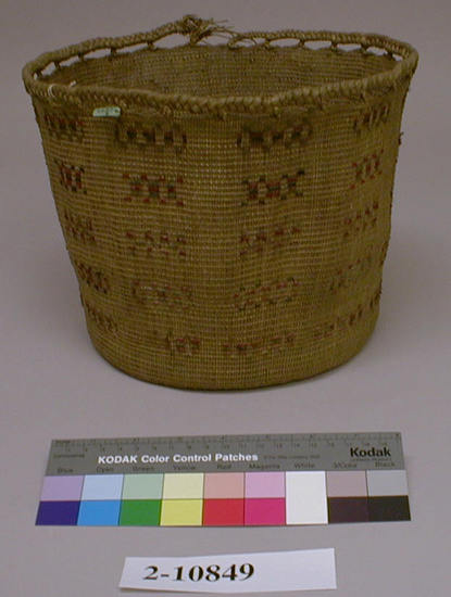 Hearst Museum object titled Basket, accession number 2-10849, described as Round. Made of twined grass decorated with red and blue woolen yarn; plaited openwork rim.