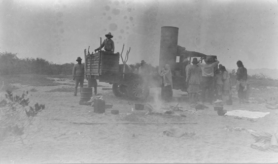 Hearst Museum object titled Black-and-white negative, accession number 15-8742, described as Group of Seri people with truck in background.