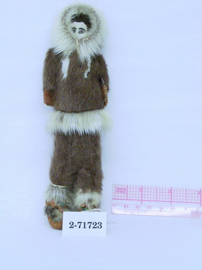 Hearst Museum object titled Doll, accession number 2-71723, described as Alaskan Eskimo doll.  Carved reindeer horn, painted features and hair.  Dressed in sealskin parka, pants and mukluks.  The parka has the arms attached to it, so that when it is removed the figure is armless.