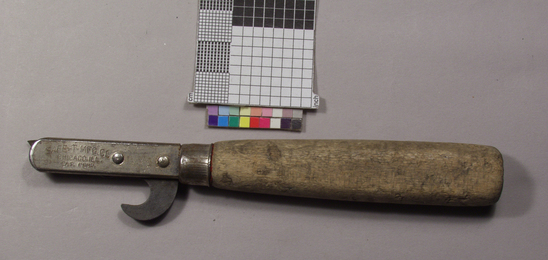 Hearst Museum object titled Can opener, accession number 2-68892, described as Caplifter/canopener combination; wood handle, nickel plated steel cap over end where shank inserts; nickel plated steel shank to which can lid piercing knife and bottle cap lifter attached by rivets;