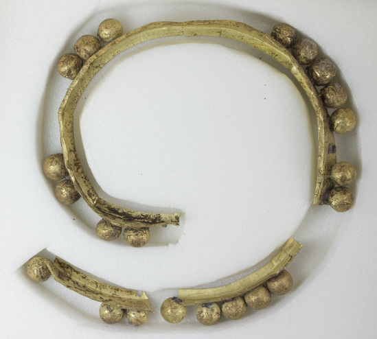 Hearst Museum object 3 of 6 titled Bracelet, accession number 4-2880, described as Gold bracelet consisting of band about ⅓ inches wide, to which 38 hollow gold beads were originally soldered. 22 of the beads remain in place. The bracelet is in 3 pieces