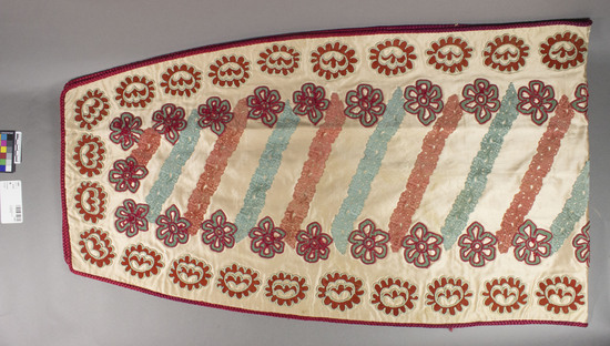 Hearst Museum object titled Textile, accession number 7-6889, described as Lined piece. Silk braid. Satin appliqued with velvet. Light red ground, varicolored appliques, red braid. 13 by 21 by 73 inches. Floral motives.