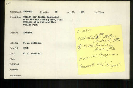 Documentation associated with Hearst Museum object titled Bow, accession number 2-10873, described as String bow, design decorated with red and black paint, ends wrapped with red and blue woolen yarn.