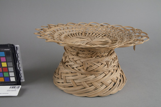 Hearst Museum object titled Basket, accession number 10-1163, described as Woven basketry mid rib of coconut leaf; flared foot; open mouth; foot; 11 3/4” dia. x 6” H.