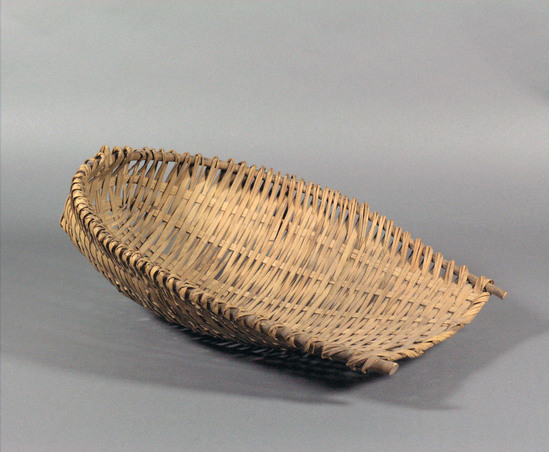 Hearst Museum object 1 of 2 titled Winnower, accession number 10-3, described as Wicker scoop; U-shaped; rice winnower; 18 inches long