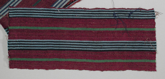 Hearst Museum object 2 of 2 titled Textile fragments, accession number 5-11277a,b, described as textile sample (section of narrow band weaving): a & b both have maroon wide stripes (2), alternating vertic. four blue and navy stripes, two narrow stripes of green.