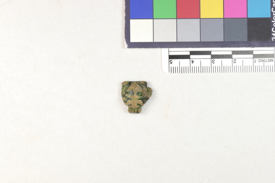 Hearst Museum object titled Amulet, accession number 5-13971, described as Amulet: anthropomorphic, head with much of features worn off. Greenish glaze on eyes, top of head and back of head.
