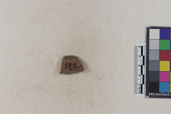 Hearst Museum object titled Potsherd, accession number 16-8185, described as Potsherd: body, red slip Section of Manta on beach currently inhabited. Numbers  8111 to 8194 are sherds picked up on beach at low tide.