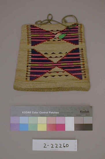 Hearst Museum object titled Bag, accession number 2-22260, described as Multi-colored corn husk bag; cornhusk and wool overlay in plain twining; geometric designs in colored wool yarn on both faces; 2 rawhide thong handles.