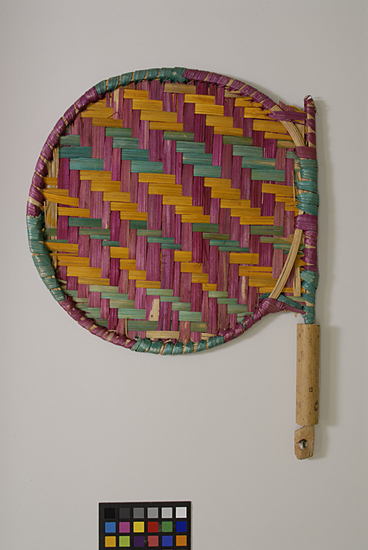 Hearst Museum object titled Fan, accession number 9-10955, described as fan, hand; date palm straw, bamboo; green, yellow, purple  35 cm length;  26.5 cm width