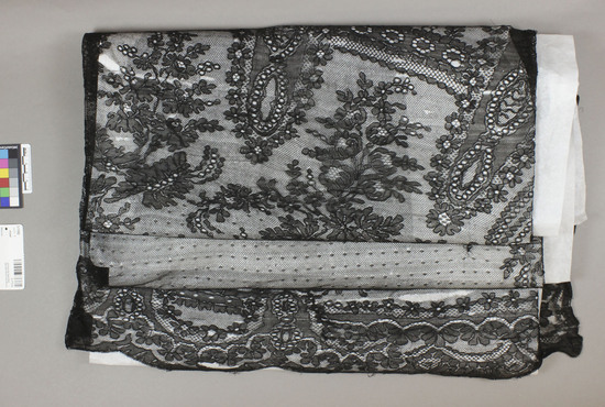 Hearst Museum object titled Shawl, accession number 3-11065, described as Black lace shawl, floral patterned.