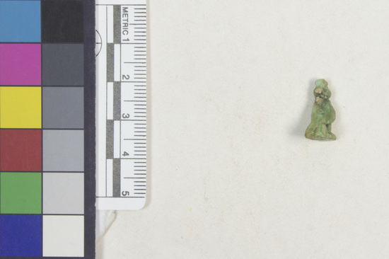 Hearst Museum object 4 of 13 titled Hawk amulet, accession number 6-22126, described as Amulet of hawk with one-handled peg on head; length 16 mm, greenish faience.