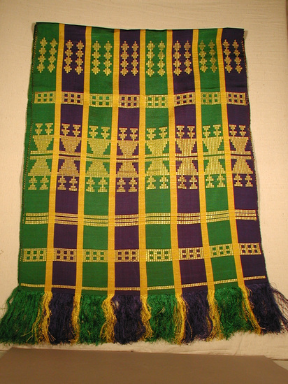 Hearst Museum object titled Shawl, accession number 5-16708, described as silk (?) shawl; grosgrain weave with blue and green 5.5cm band separated by 1.5cm yellow bands decorated with supplementary weft float of yellow in each blue/green stripe. finished with 13cm warp fringe on each end.