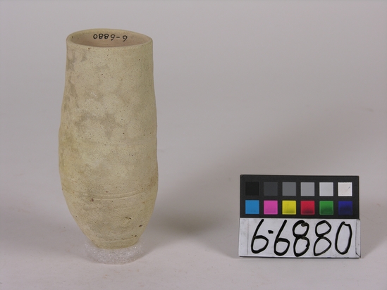 Hearst Museum object 1 of 3 titled Beer cup, accession number 6-6880, described as Pottery: deep pointed bottomed buff jar, least diameter 4.5, greatest diameter 6, height 16 cm.