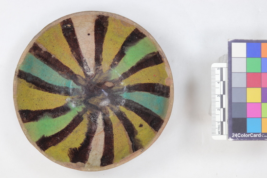 Hearst Museum object 1 of 4 titled Bowl, accession number 6-20273, described as Pottery bowl, green and yellow glaze, black stripes; diameter 12 cm. Arabic.