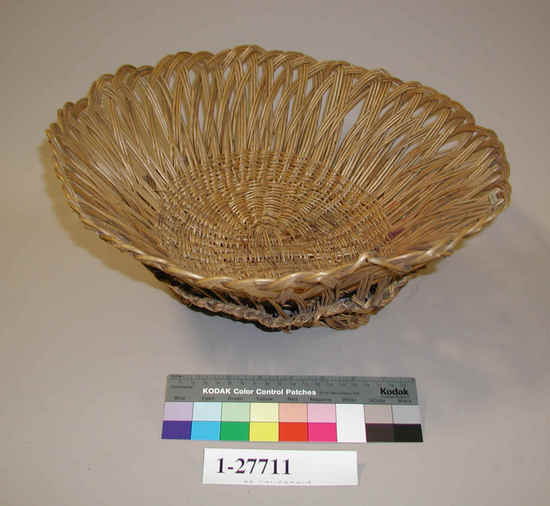 Hearst Museum object titled Basket, accession number 1-27711, described as Round, flaring sides formed by open loops, pedestal effect at base, broken in some areas. Wicker.