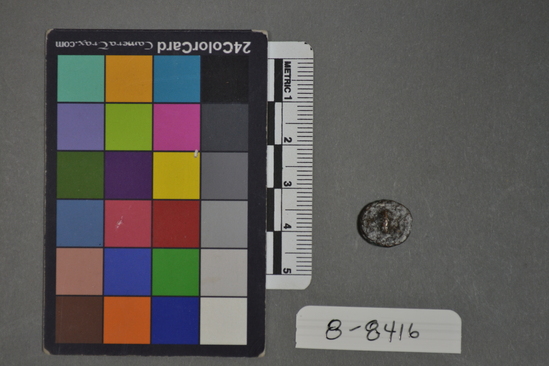 Hearst Museum object 3 of 8 titled Coin: æ, accession number 8-8416, described as Coin, metal, patina, very worn. In bag with other similar coins, note paper had no id on it. One side has faint markings of a face in profile. The other side is too distressed to id markings but has a lump remaining from the design.