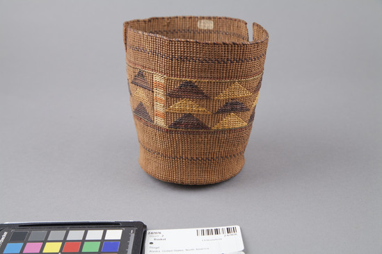 Hearst Museum object 2 of 3 titled Basket, accession number 2-67076, described as Twined and slightly flared, several multicolored bands, central design has stacks of colored triangles alternating with vertical bands of yellow and orange. Two rips from rim.