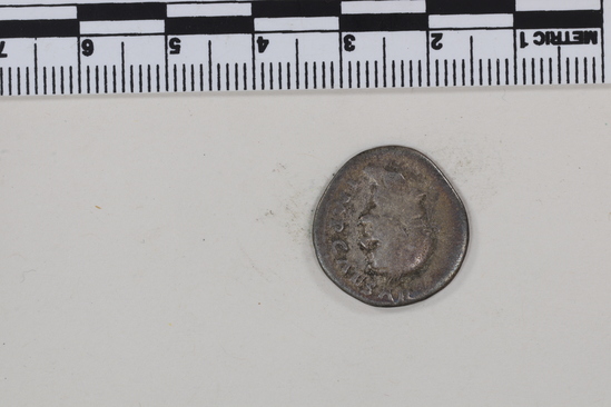 Hearst Museum object 4 of 8 titled Coin: ar denarius, accession number 8-4690, described as Coin; AR; Denarius; Roman. Vespasian, 74 AD. Rome, Italy. Obverse: IMP CAESAR ___ ___, bust r. laureate. Reverse: COS V; to left and right, two laurel branches. CF American Numismatic Society coin 1985.140.42 with inscription Obverse: IMP CAESAR VESP AVG. Reverse: COS V.