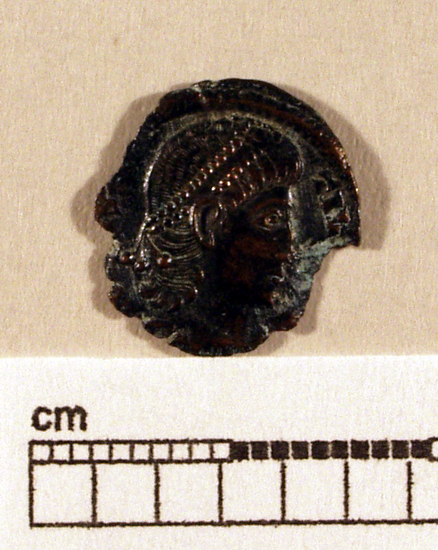 Hearst Museum object titled Coin: æ 4, accession number 8-7035, described as Coin, Aes Follis 4,  ___ grams. ___ mm. Obverse: Constantius II. Reverse: VOT / XX / MVLT / XXX. Reverse does not match catalog card.