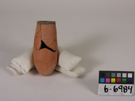 Hearst Museum object titled Broken beer cup, accession number 6-6984, described as Pottery: deep pointed-bottomed red cup, broken, black band.