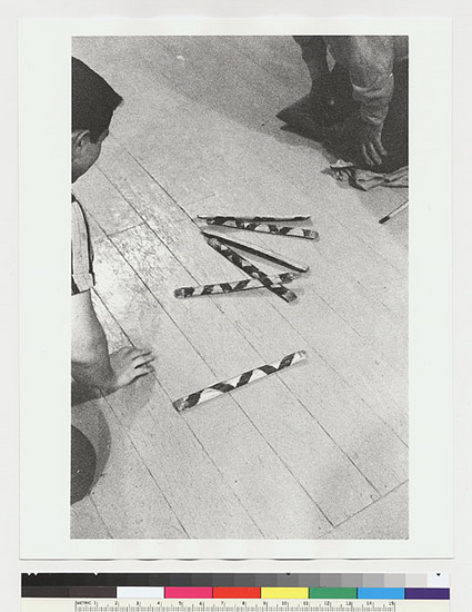 Hearst Museum object titled Black-and-white negative, accession number 15-19521, described as Sidney Parrish and David Peri playing stick game