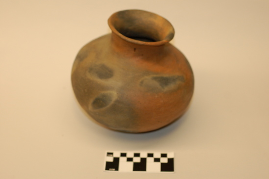 Hearst Museum object titled Olla, accession number 3-13035, described as Olla/ liquid container, ceramic, earthenware, narrow neck, flaring rim, burn clouds on exterior, cracked; height 16.1 cm x diameter 18.8 cm.