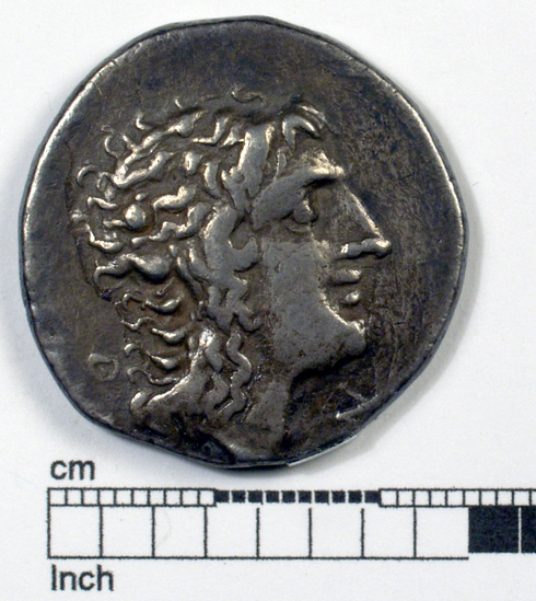 Hearst Museum object titled Coin: ar tetradrachm, accession number 8-4408, described as Coin; AR; Tetradrachm; Greek. 16.34 grams, 28 mm. Aesillas, 89 BC. Thessaloniki, Greece. Obverse: ......N, bust of Alexander the Great r. Reverse: AESILLAS, club between fissus and subsellium; to r., q.