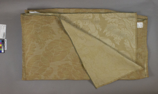 Hearst Museum object titled Textile sample, accession number 2-62493, described as Yardage; cotton, rayon?, damask, colors orange, yellow, blue and light brown, floral motives, Jacquard looms