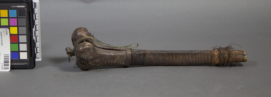 Hearst Museum object 1 of 2 titled Thighbone trumpet, accession number 9-12790, described as Trumpet (thighbone trumpet);human femur wrapped w/copper wire & leather;L. 31 cm. CONTEXTUSE info supplied by Prof.Lewis Lancaster,UCB  Dept. of Oriental Languages, 1976