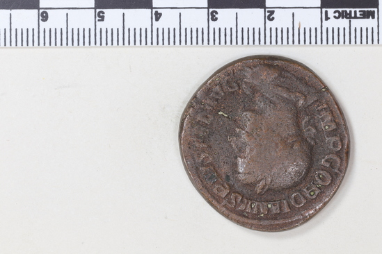 Hearst Museum object 5 of 8 titled Coin: æ sestertius, accession number 8-5924, described as Coin: Sestertius; Æ; Gordianus.Pius - 21.13 grams. Rome, 240-244 AD. Obverse: IMP GORDIANVS PIVS FEL AVG - bust facing right, laureate, draped, cuirassed. Reverse: IOVI STATORI, SC - Jupiter standing facing left, holds long scepter and thunderbolt.