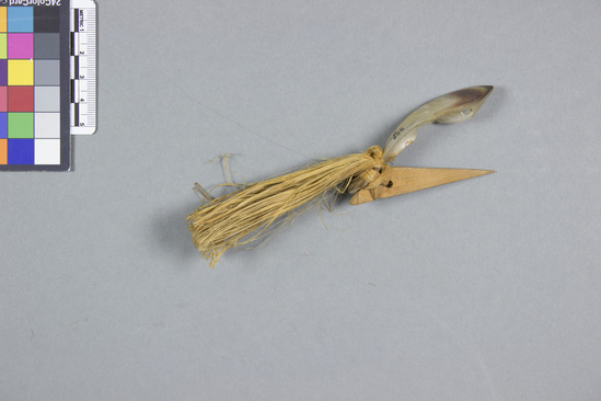 Hearst Museum object titled Fishhook and fishing lure, accession number 11-606, described as Pearl fish-hook; fibre beard, dyed yellow.