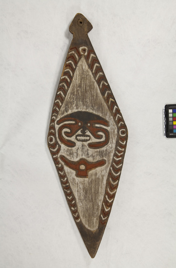 Hearst Museum object titled Memorial board/shield, accession number 11-2048, described as Carved wooden shield.