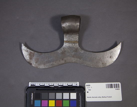 Hearst Museum object 1 of 3 titled Axe, accession number 9-6659, described as Forged iron axe head; incised dot gond pattern; width 8  3/4 inches; used by  Gondi speakers in Madhya Pradesh.