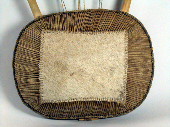 Hearst Museum object 2 of 9 titled Lyre, accession number 5-6641, described as bowl lyre; traditional lyre shape; top and side pieces straight solid cylindrical sticks; wood sound box with sound table of reptile skin; back covered with goat hide; skin lacing; 1 sound hole; 8 twisted gut strings.